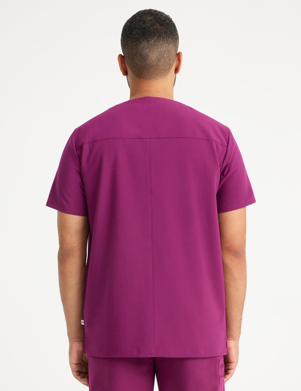 Limited edition men&#39;s V-neck scrub top in royal blue with three pockets, combining style and practicality