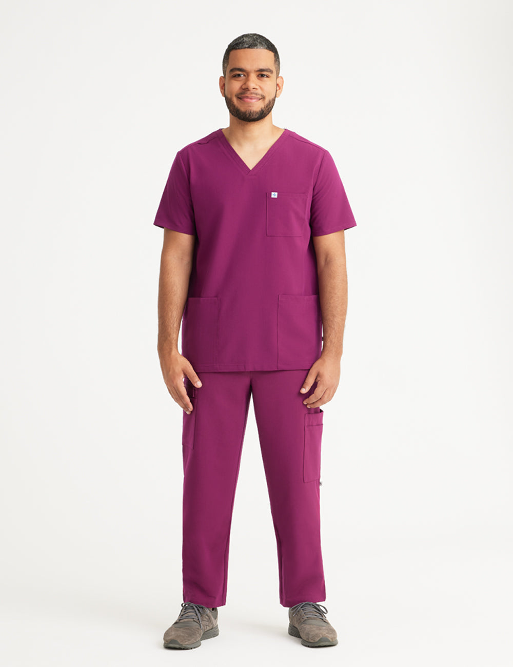 Unique ceil blue men&#39;s V-neck scrub top, part of a limited edition collection, featuring three convenient pockets