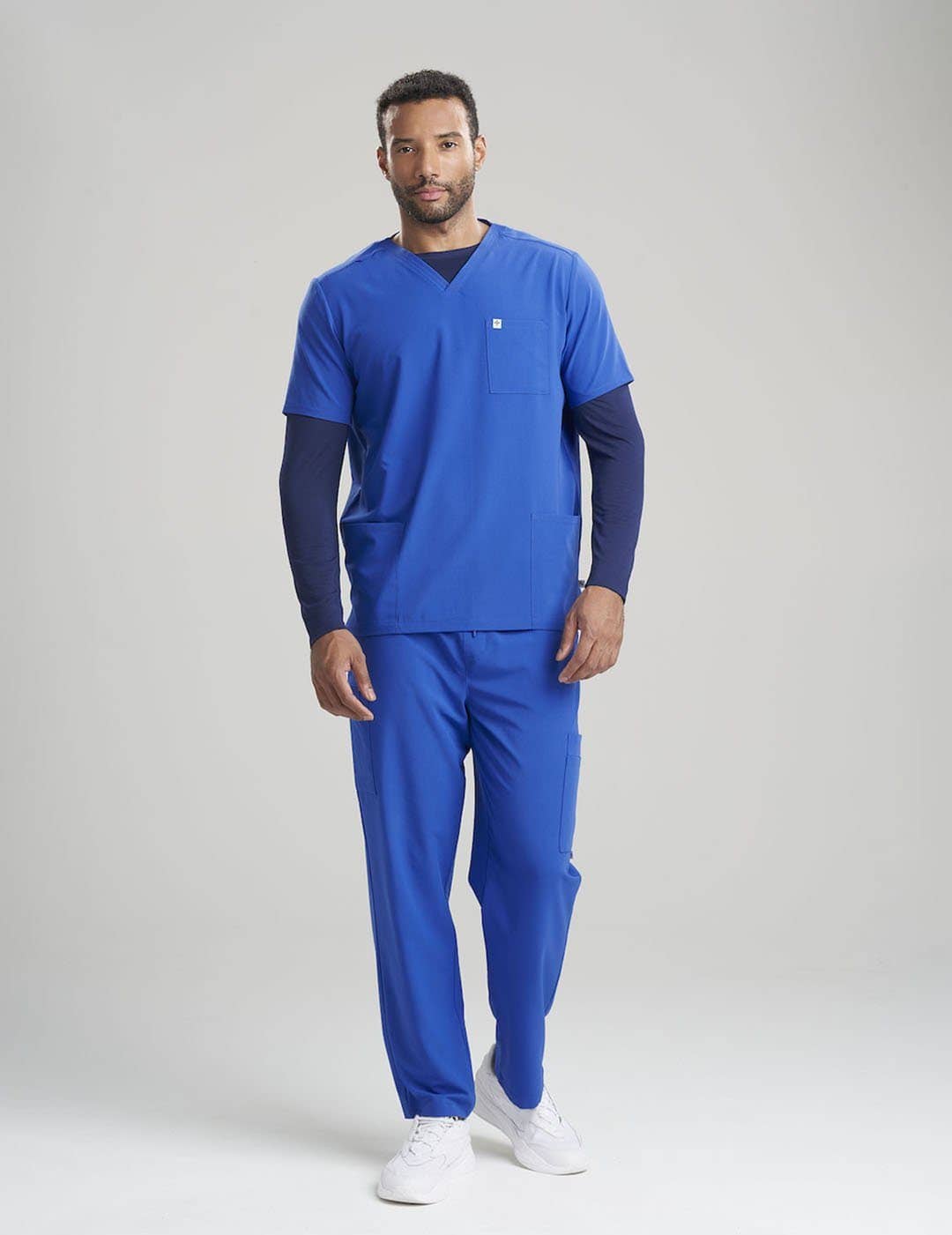 Durable men&#39;s scrub top in limited edition ceil blue, offering a modern fit and practical three-pocket design