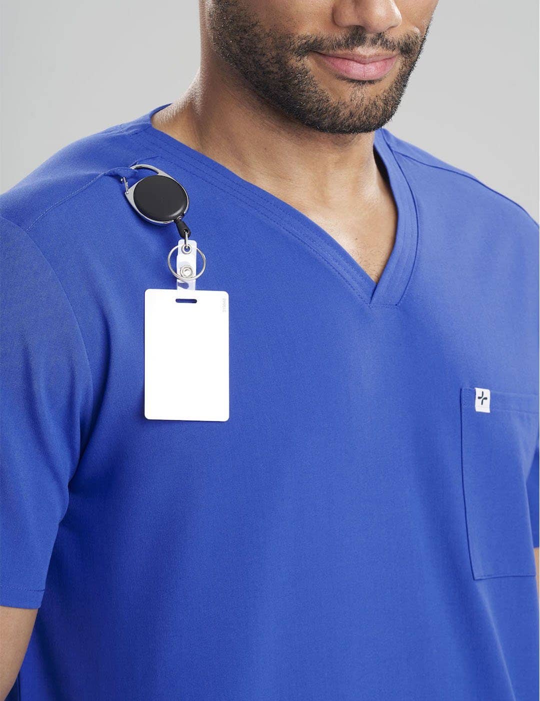 Limited edition men&#39;s V-neck scrub top in ceil blue with three pockets, designed for comfort and style