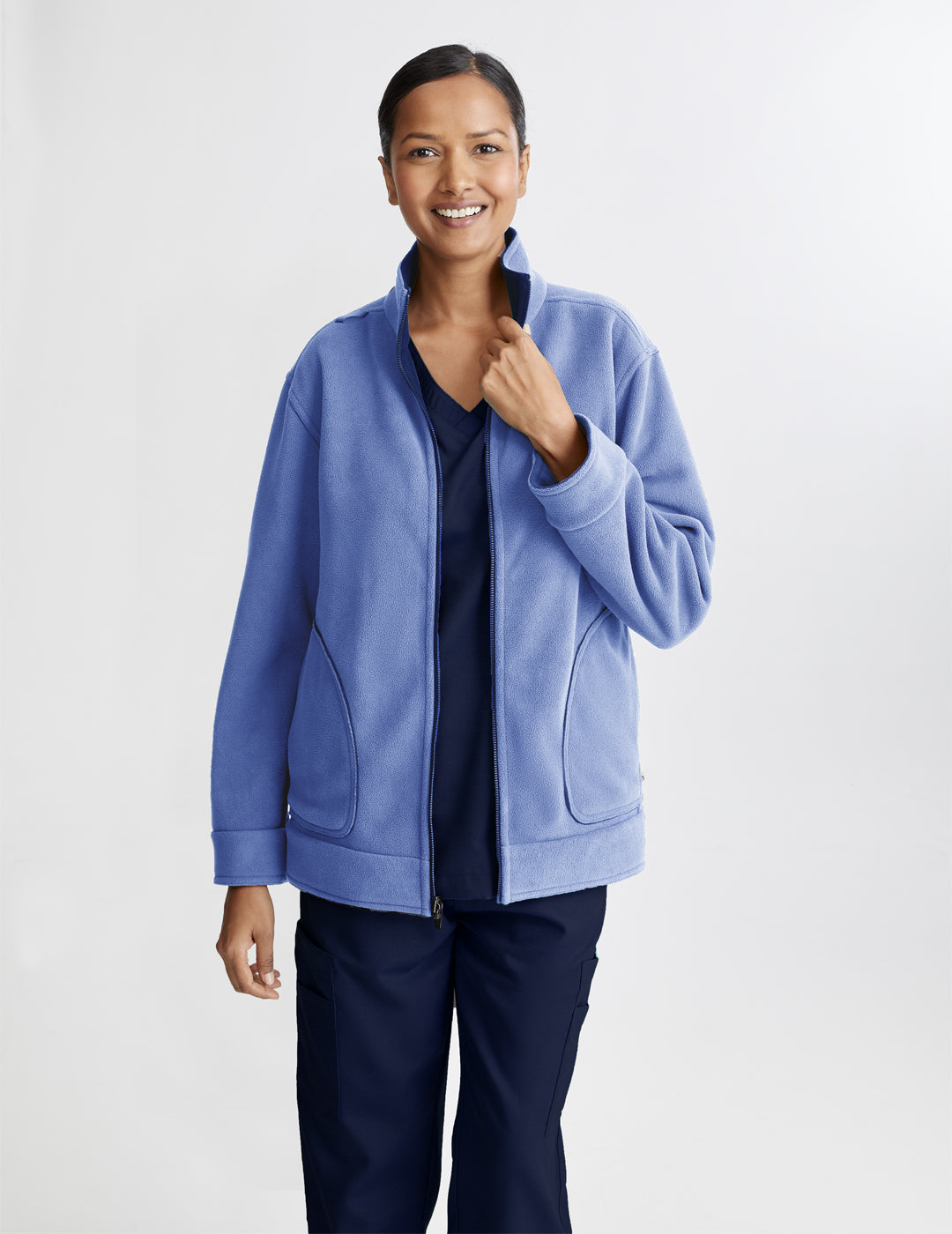 Women&#39;s reversible fleece jacket in navy and ceil, offering versatility and warmth