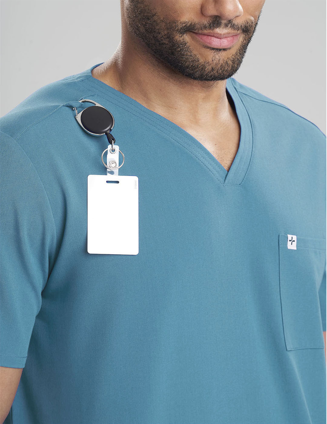 Limited edition men&#39;s scrub top in royal blue, designed for utility, comfort, and a sleek V-neck look