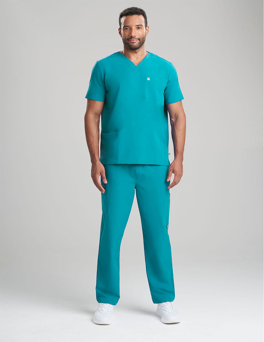 Unique royal blue men&#39;s V-neck scrub top, part of a limited edition collection, with three convenient pockets