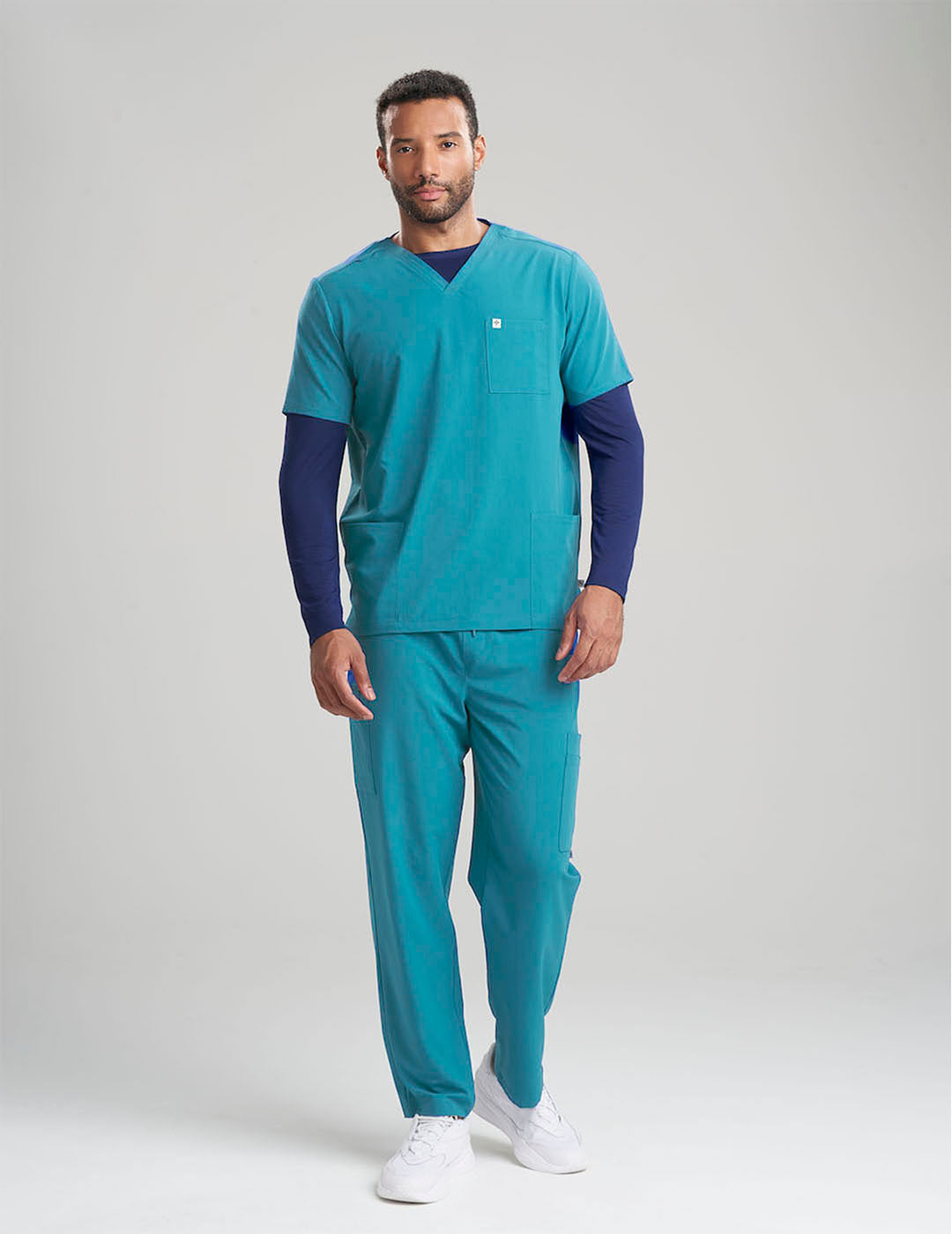 Functional and professional limited edition V-neck scrub top in royal blue, tailored for utility and modern style