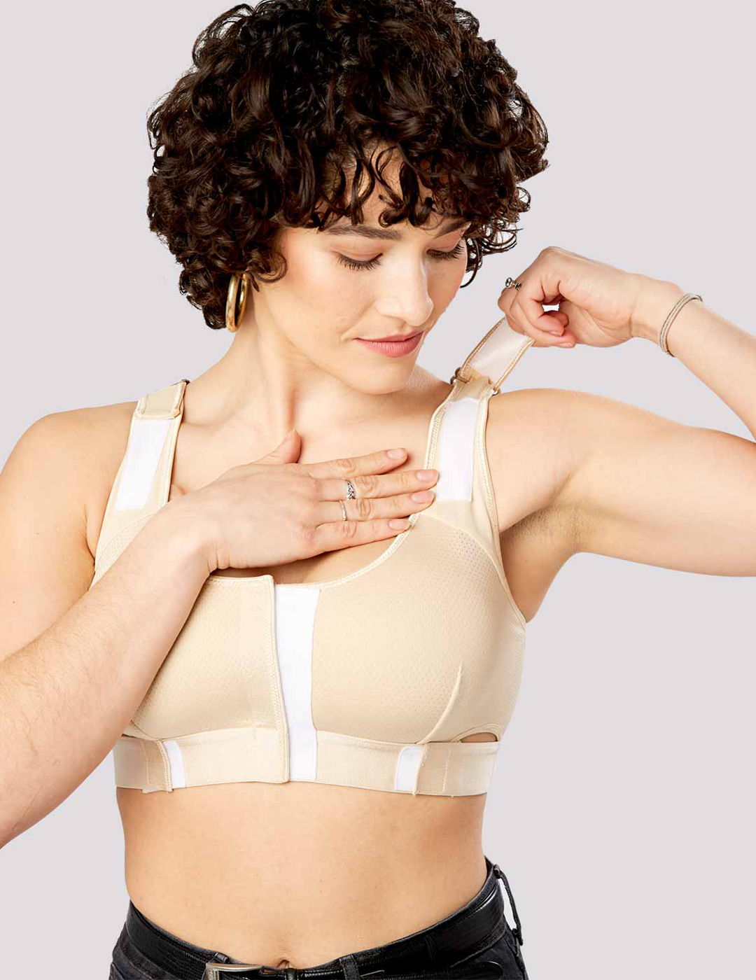 Bold leopard The Believer Bra, offering secure post-surgical support with a trendy pattern that adds flair to recovery wear. Model is wearing size Medium